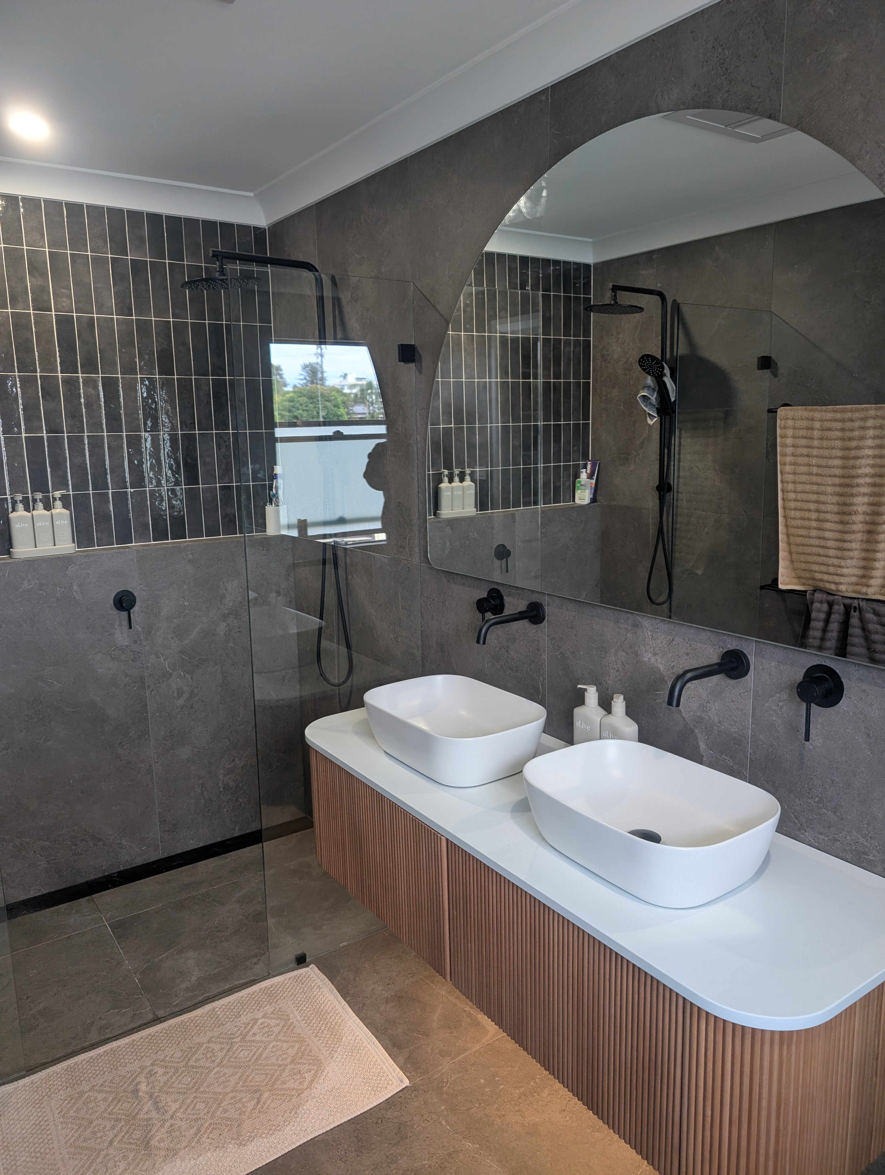 Completed bathroom renovation by Rhythm Plumbing Co